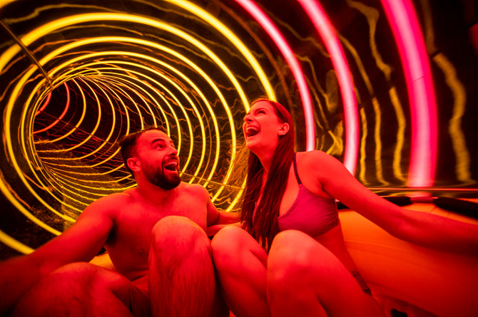 Adventure Island Tampa - couple riding Solar Vortex tube slide