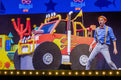 Blippi on stage with a monster truck.