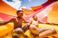 Adventure Island Tampa - Two boys having fun on Solar Vortex tube slide